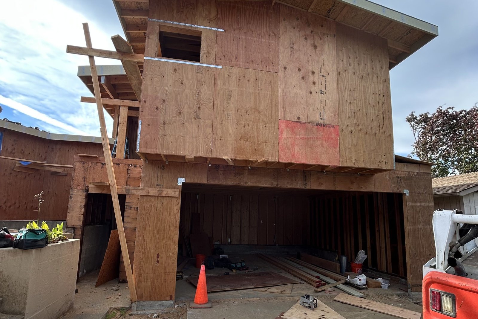New second story built over a widened garage opening